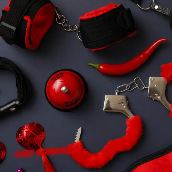 A collection of BDSM gear: Handcuffs, restraints, and sensory tools for enhancing kink play and power dynamics