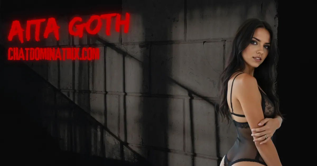 Aita Goth in black lingerie against dungeon wall, representing BDSM psychology, ego death, and the emotional breaking of a submissive in power exchange