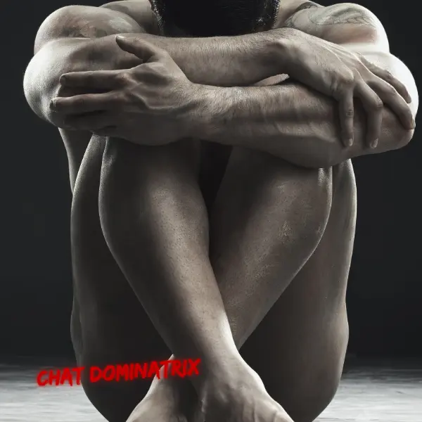 Naked, vulnerable submissive man curled in a defensive posture, illustrating the psychological intensity of CFNM dynamics