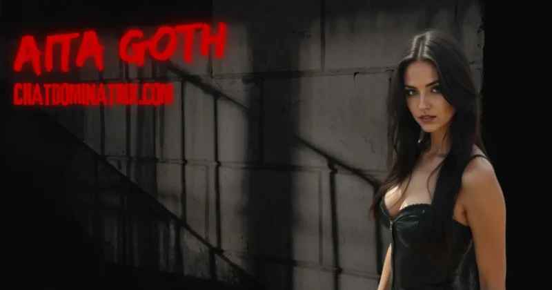 Dark sensual portrait of a dominant woman in a black leather corset, standing against a concrete wall cast in moody shadows. Her intense gaze and commanding presence evoke the essence of BDSM ritual, control, precision, and psychological surrender. The red neon “AITA GOTH” and ChatDominatrix.com branding signal authority and allure in the world of femdom discipline and ritual structure.