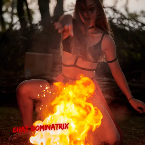 Fire and Domination – A sensual fire performer kneels before roaring flames, embodying the intensity of fire play in BDSM.