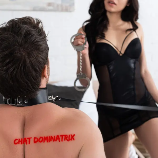 A dominant woman in sheer black lingerie holds a pair of handcuffs, looking down at her collared submissive partner, ready to take control. Learn the fundamentals of training a submissive partner in femdom, communication, trust, and power dynamics explored.