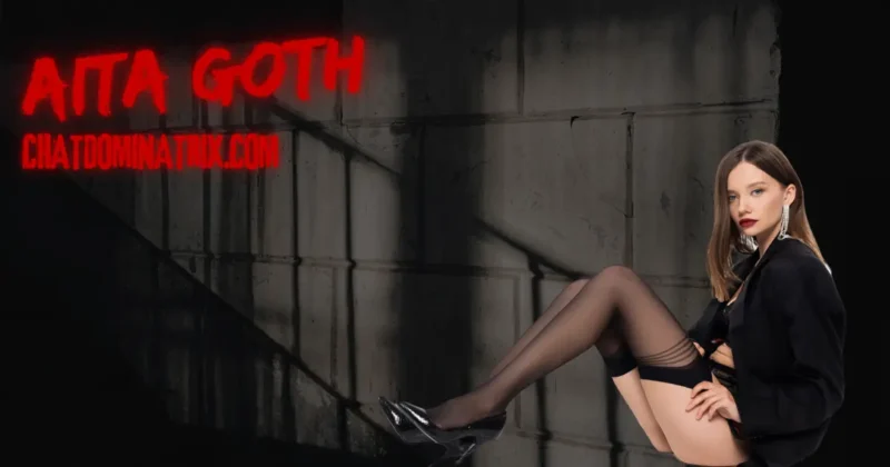 Mistress Aita Goth: A seductive woman in black lingerie and high heels lounges against a dark, industrial backdrop, embodying power, dominance, and irresistible allure