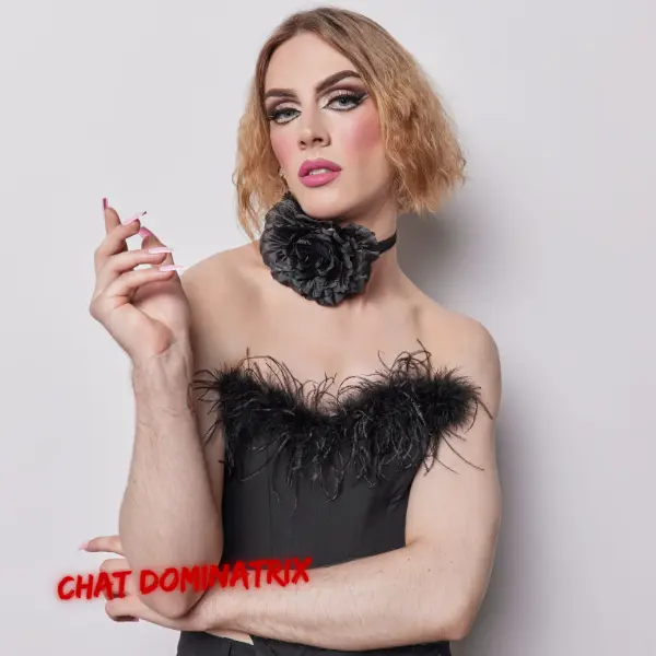 Elegant androgynous figure in a black feathered outfit, representing confidence and transformation in the world of sissification