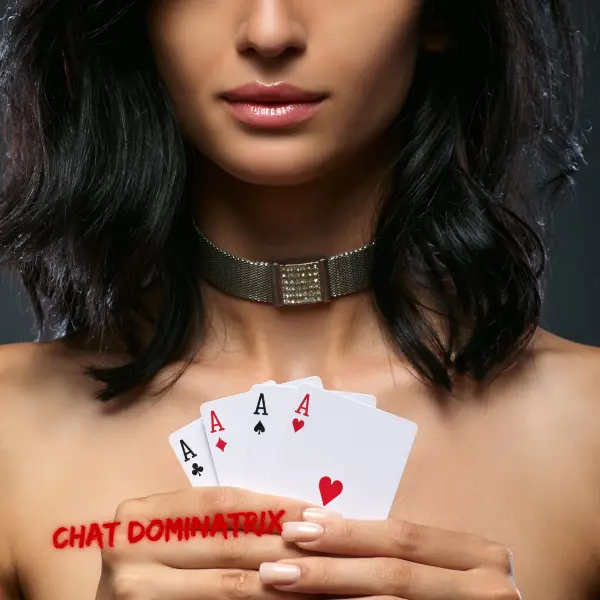 A playful yet commanding woman holding a set of playing cards, adorned with a sparkling choker, teasing with the power of chance and control. Short Femdom Stories by Aita Goth on Chat Dominatrix