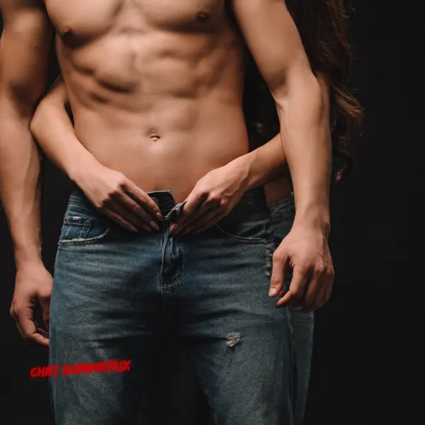 Woman’s hands teasingly unbuttoning a man’s jeans – a visual representation of power dynamics and role-play in consensual non-consent.