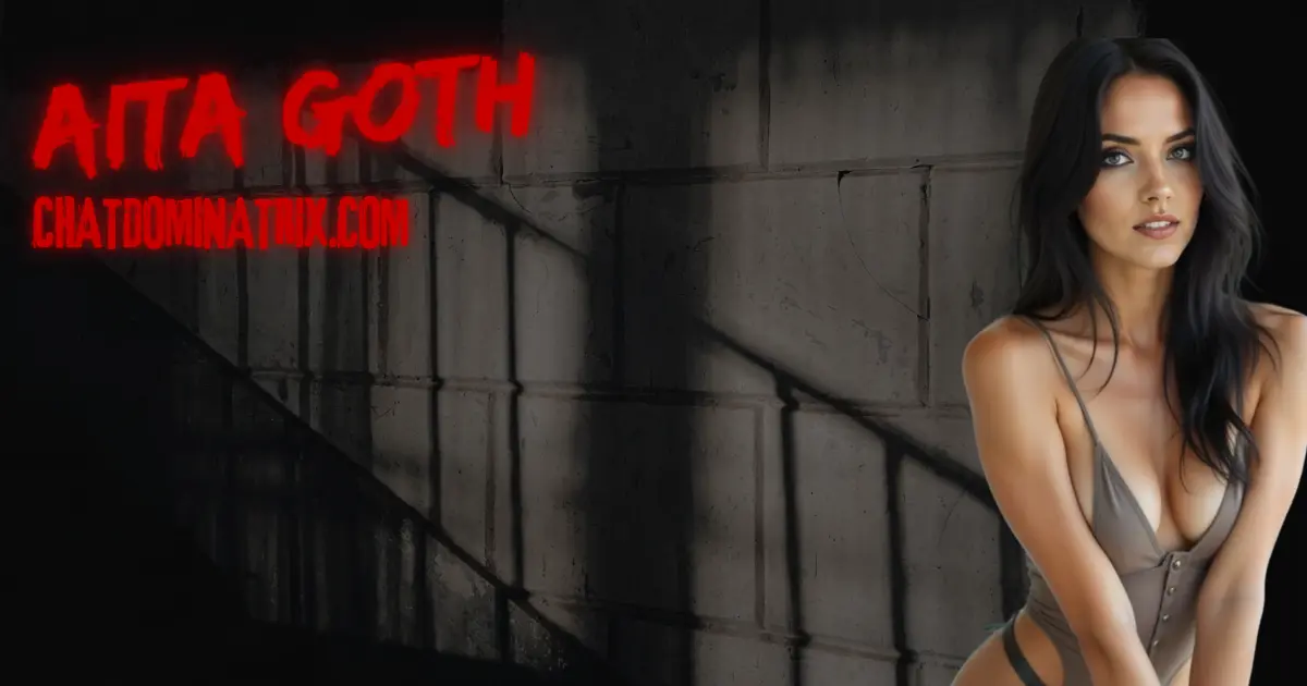 Dominatrix Aita Goth in revealing bodysuit beside dungeon wall, representing keyholding authority and psychological power in male chastity submission